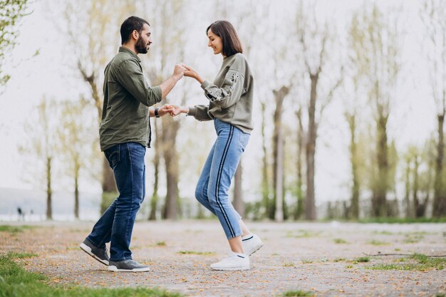 Young international couple together in park