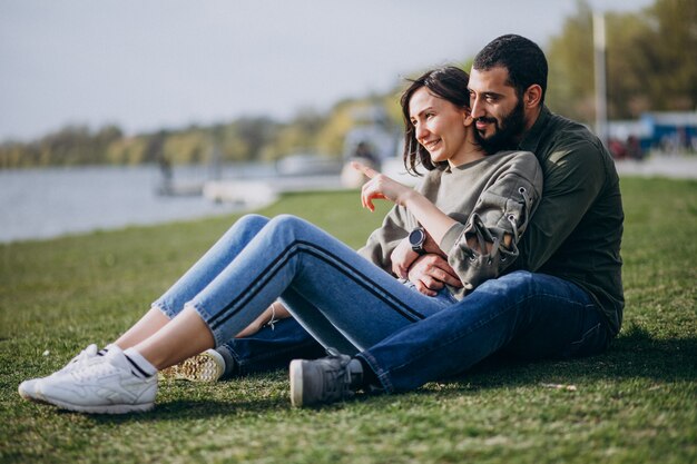 Young international couple together in park