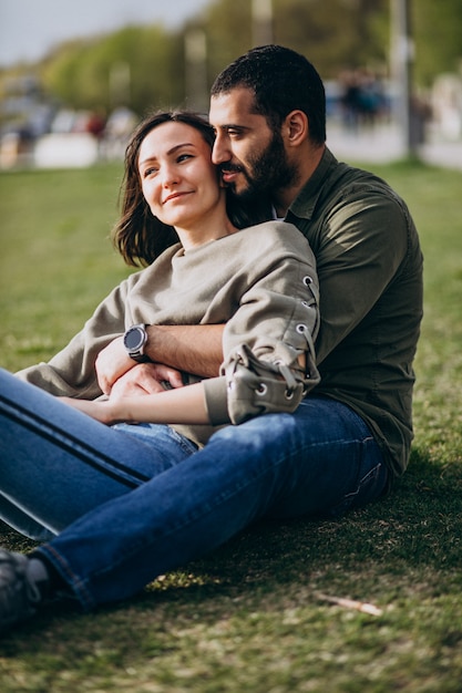 Young international couple together in park