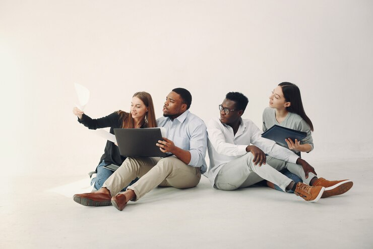 Free Photo young international people working together and use the laptop