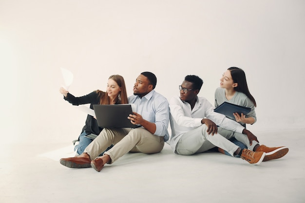 Young international people working together and use the laptop