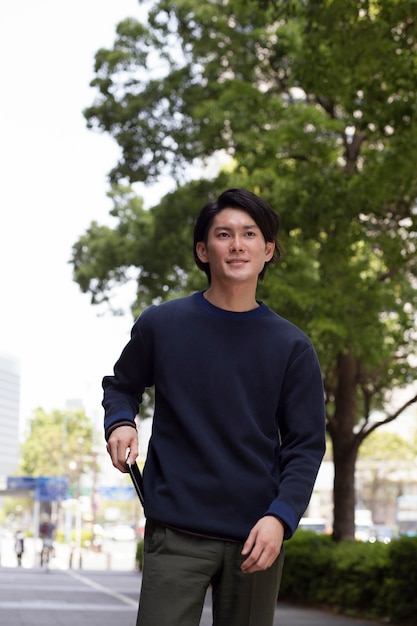Young japanese man in a blue sweater