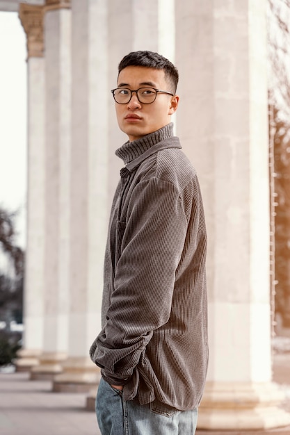 Free photo young japanese man portrait side view