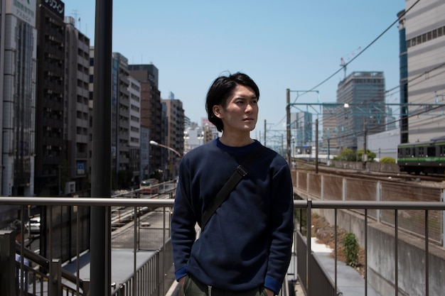 Young japanese man spending time outdoors