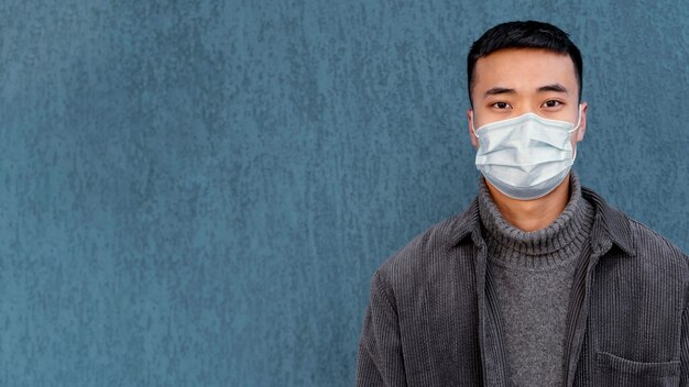 Young japanese man wearing mask