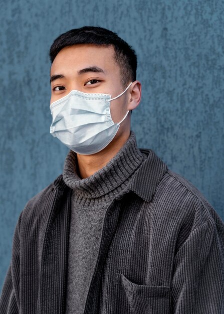 Young japanese man wearing mask