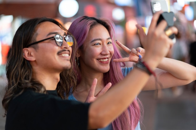 Free photo young japanese man and woman portrait