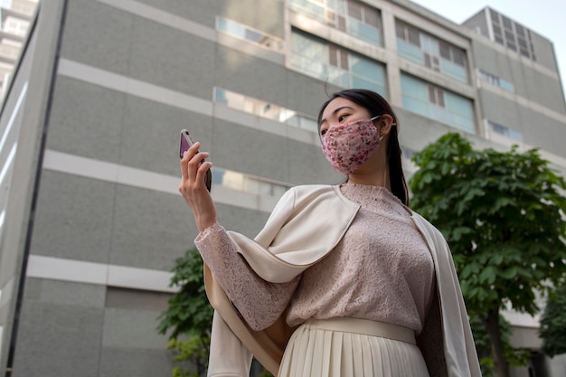 Free photo young japanese woman in the city