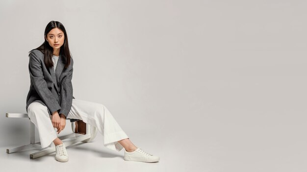 Young japanese woman portrait sitting on chair