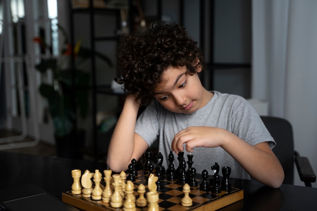 Young kid playing chess