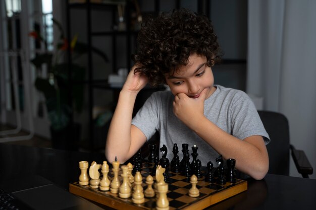 Young kid playing chess