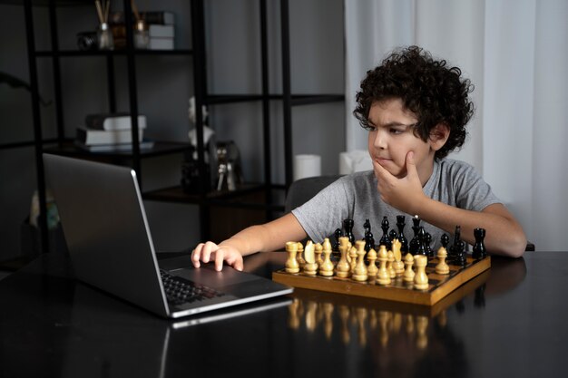 Young kid playing chess