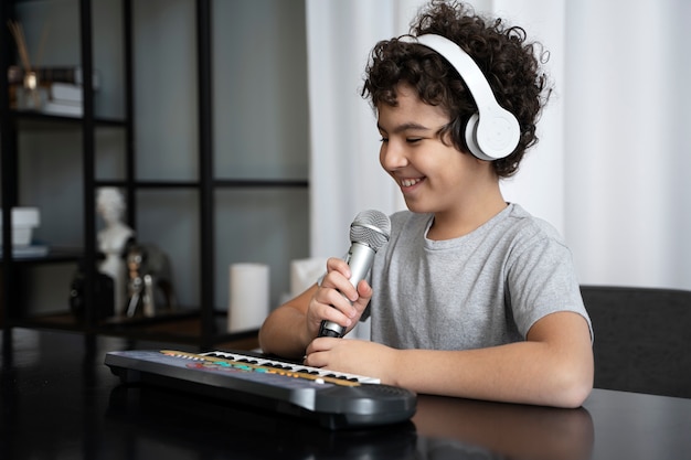 Free photo young kid playing music