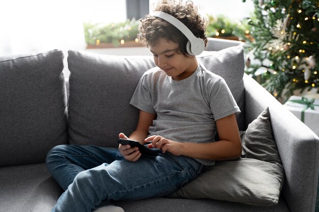 Young kid playing on smartphone