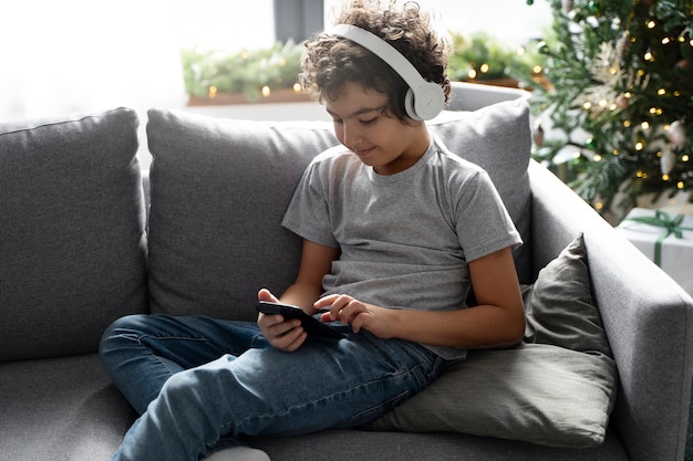 Young kid playing on smartphone