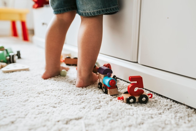 Free photo young kid standing in a playroom