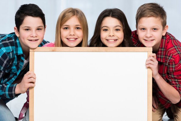 Young kids holding frame