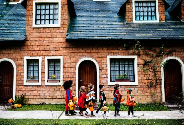 Young kids trick or treating during Halloween