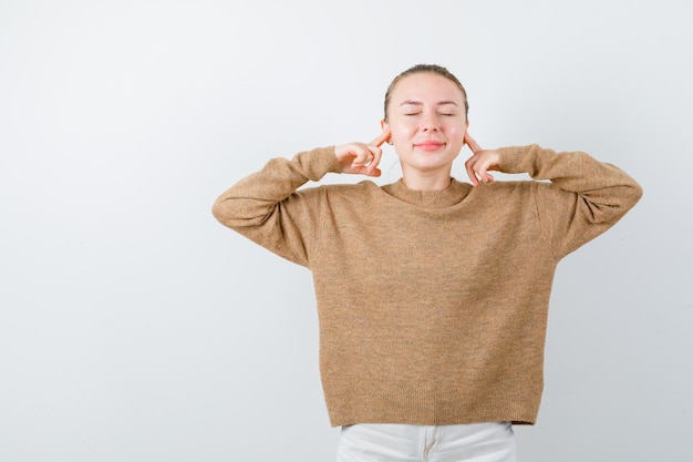 The young lady doesnt want hear any sound on white background