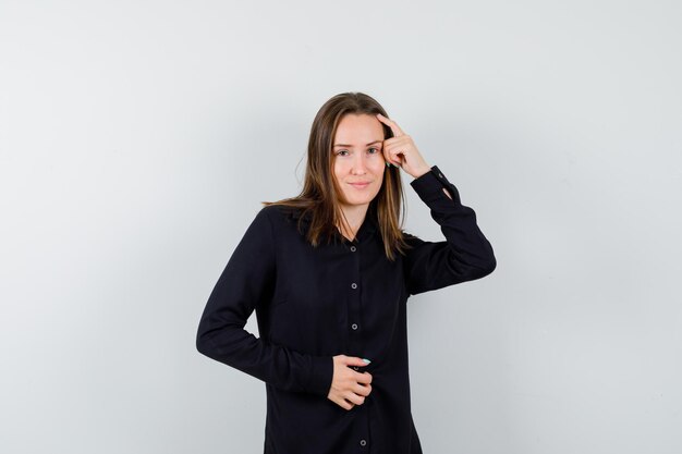 Young lady posing with hand on head