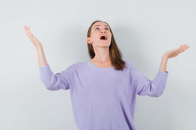 Young lady raising hands