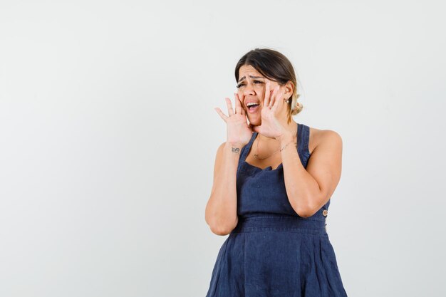 Young lady shouting or announcing something in dress