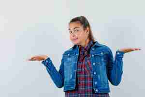 Free photo young lady showing helpless gesture in shirt, jacket and looking confused. front view.