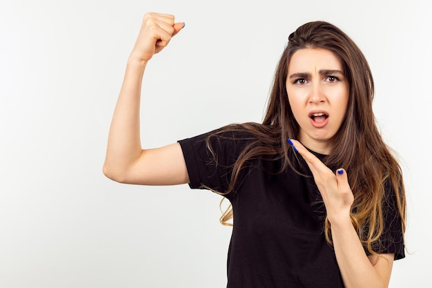 Young lady squeezed her fist and looking at the camera