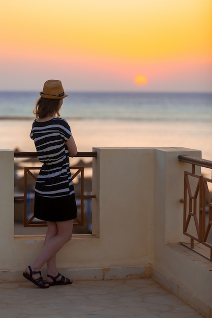 Free photo young lady watching sunrise