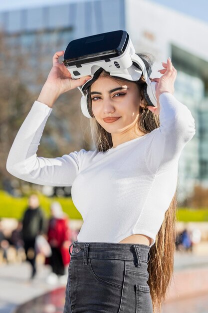 A young lady wears virtual reality glasses High quality photo