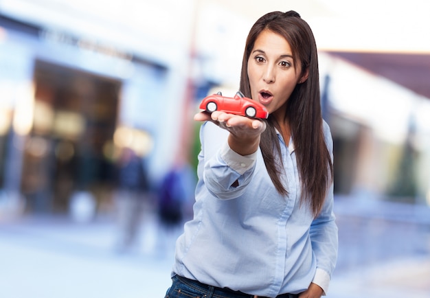 Free photo young lady with a toy on her hand