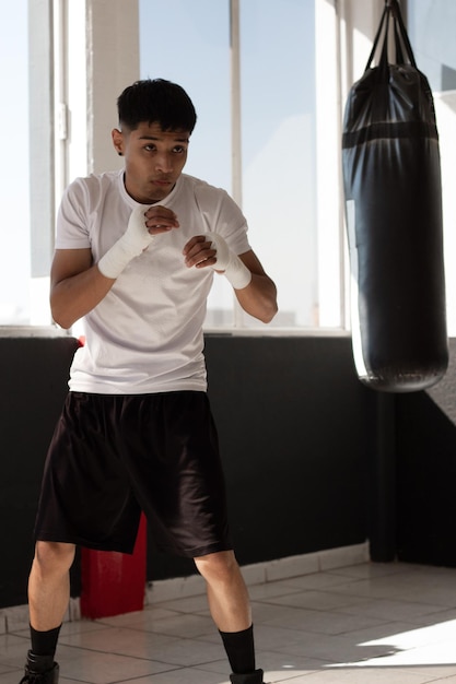 Premium Photo | Young latino boxer training with discipline and ...