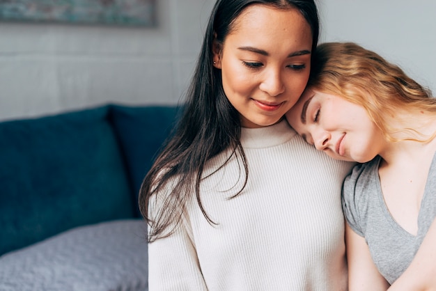 Free photo young lesbian couple embracing