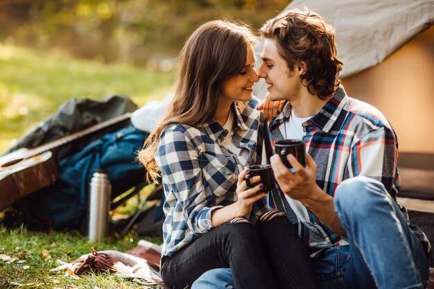 Young loved couple have a date in the forest