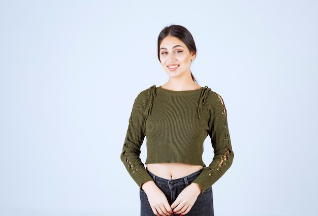 A young lovely woman model smiling happily on white background