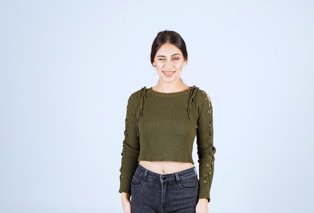 A young lovely woman model standing on white background