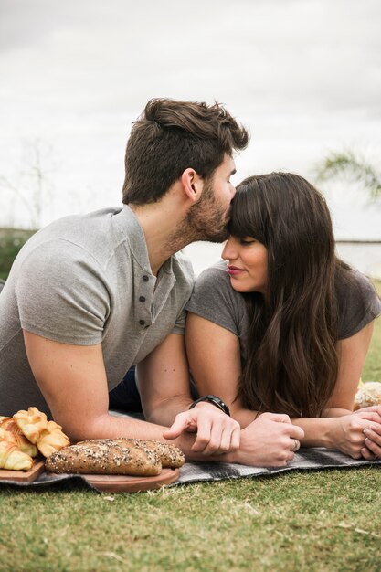 Young loving couple in the park