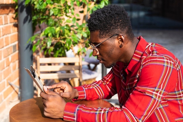 Young male adult reading side view