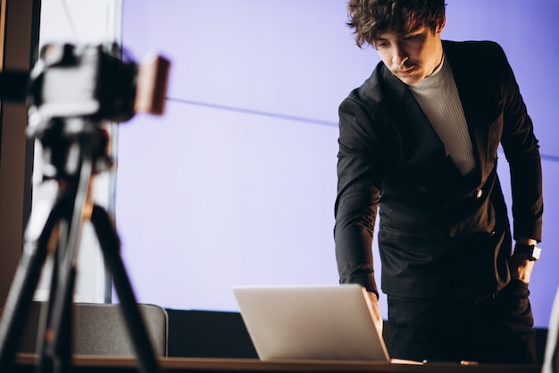 Free photo young male blogger at a recording station