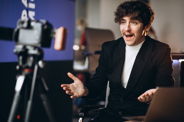 Free photo young male blogger at a recording station