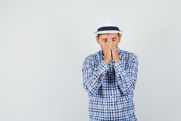 Free photo young male in checked shirt