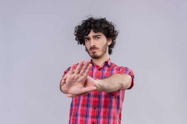 Young male curly hair isolated  colorful shirt palm