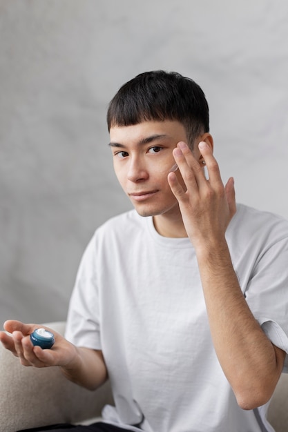 Young male doing selfcare routine