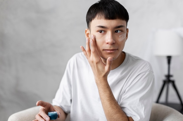 Free photo young male doing selfcare routine