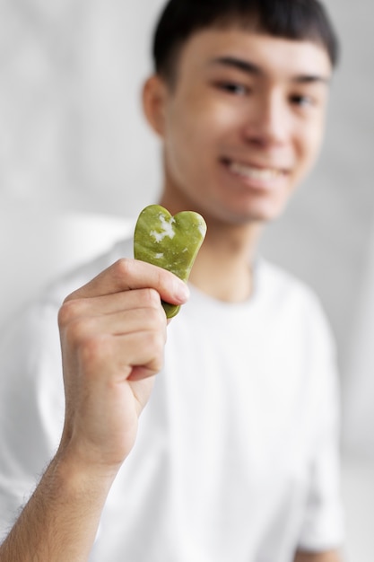 Free photo young male doing selfcare routine