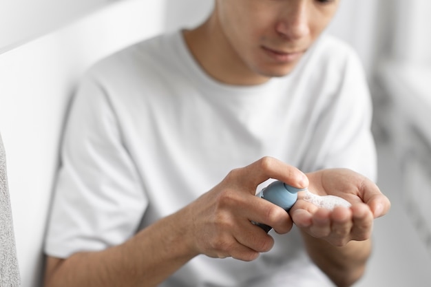 Free photo young male doing selfcare routine