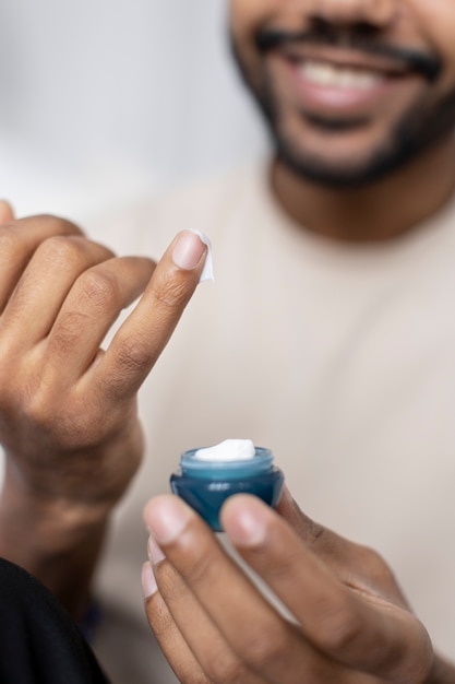 Free photo young male doing selfcare routine