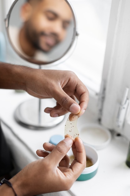 Young male doing selfcare routine