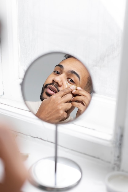 Free photo young male doing selfcare routine