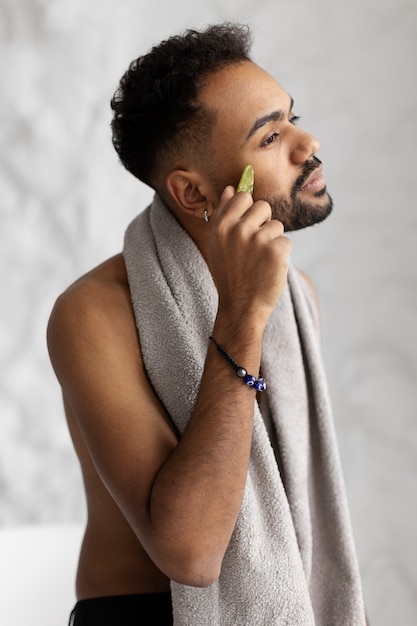 Free photo young male doing selfcare routine